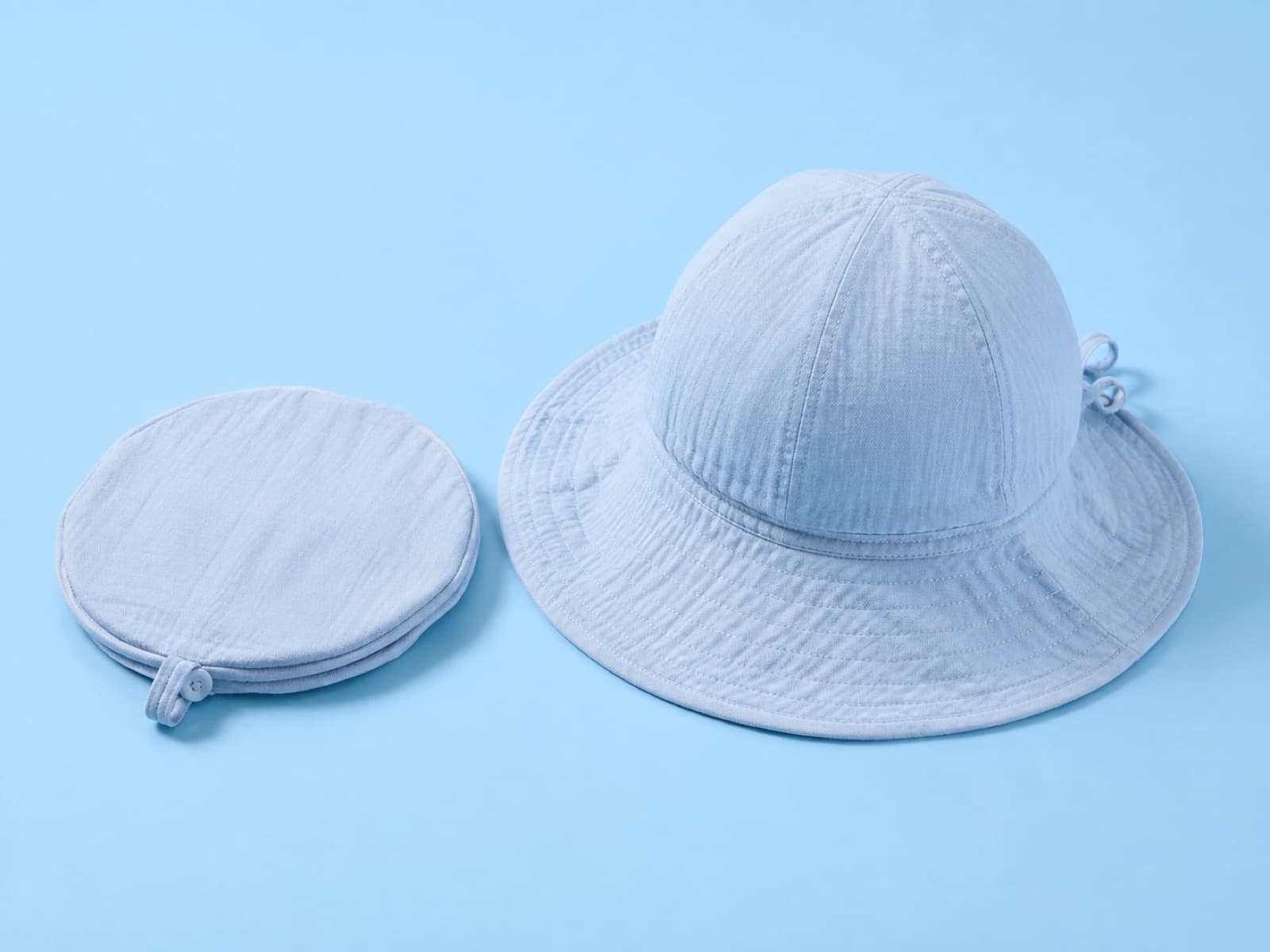 The packable junior hat folded beside the same hat shaped